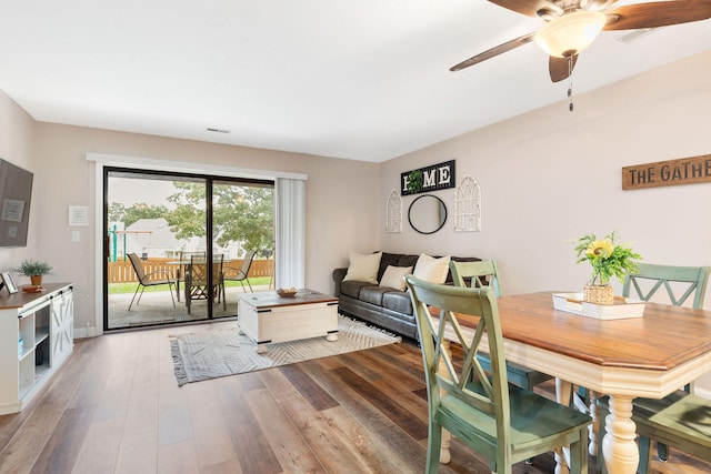 dining room with wood-type flooring and ceiling fan