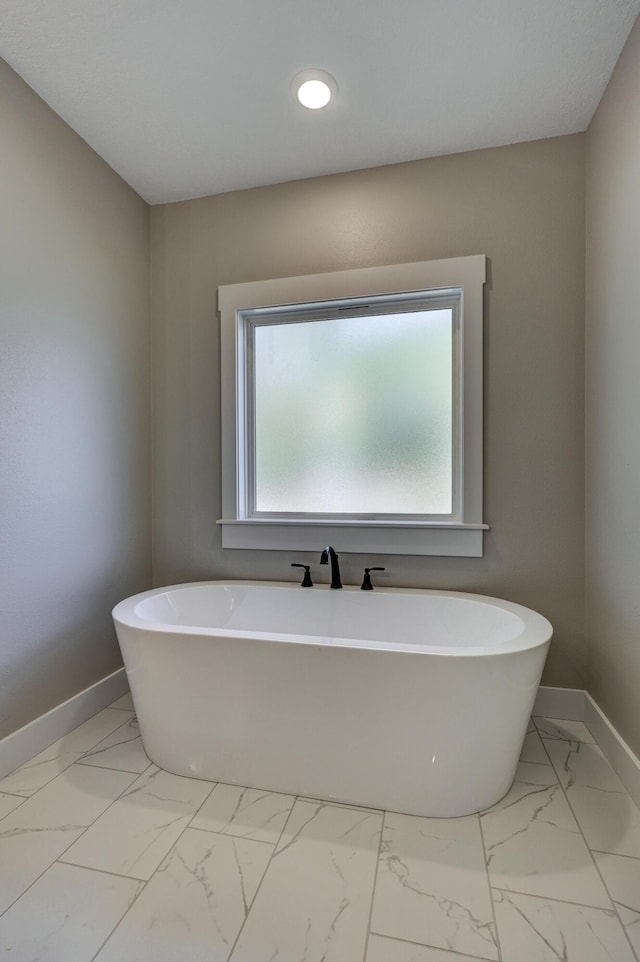 bathroom featuring a tub