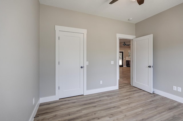 unfurnished bedroom with a closet, ceiling fan, and light hardwood / wood-style flooring