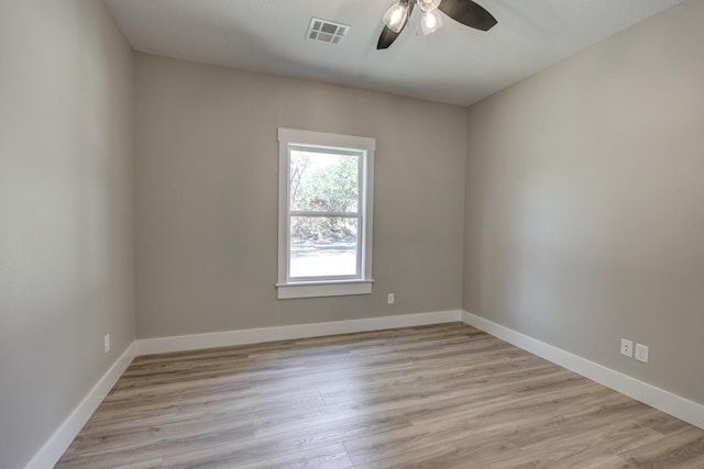 empty room featuring light wood-type flooring and ceiling fan