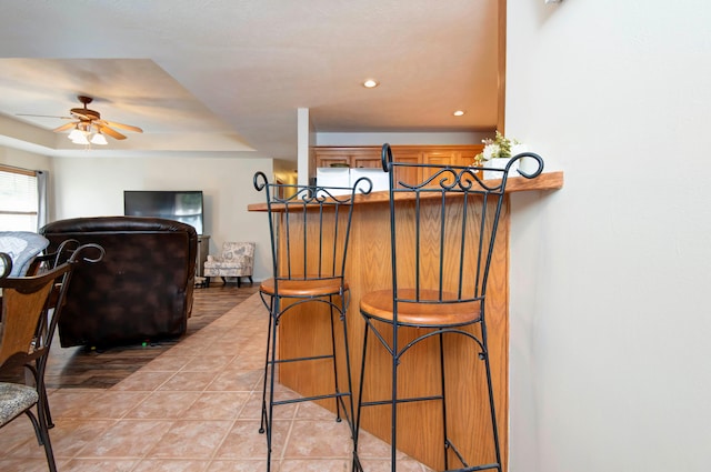 kitchen with light tile patterned floors and ceiling fan