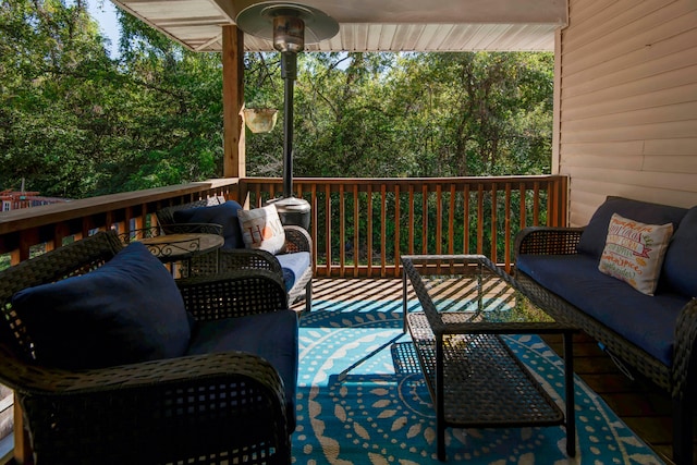 wooden terrace featuring an outdoor hangout area