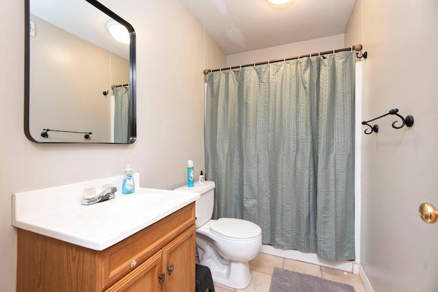 bathroom featuring walk in shower, tile patterned flooring, vanity, and toilet