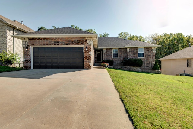 view of front of property with a garage and a front yard