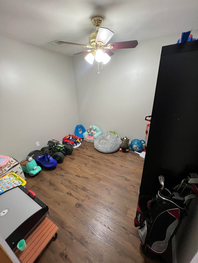 bedroom featuring wood-type flooring and ceiling fan