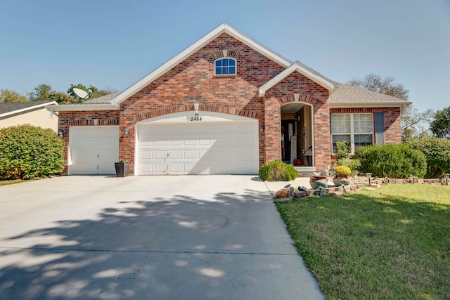 view of front property with a front lawn and a garage