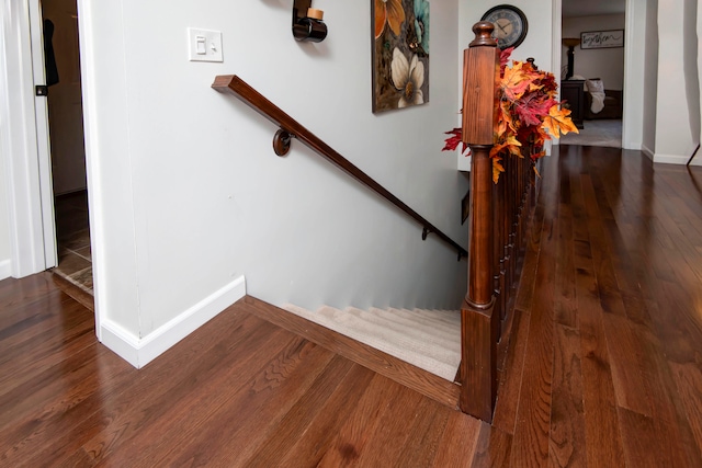 stairs featuring wood-type flooring