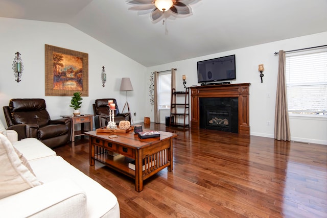 living room featuring lofted ceiling, ceiling fan, and dark hardwood / wood-style floors