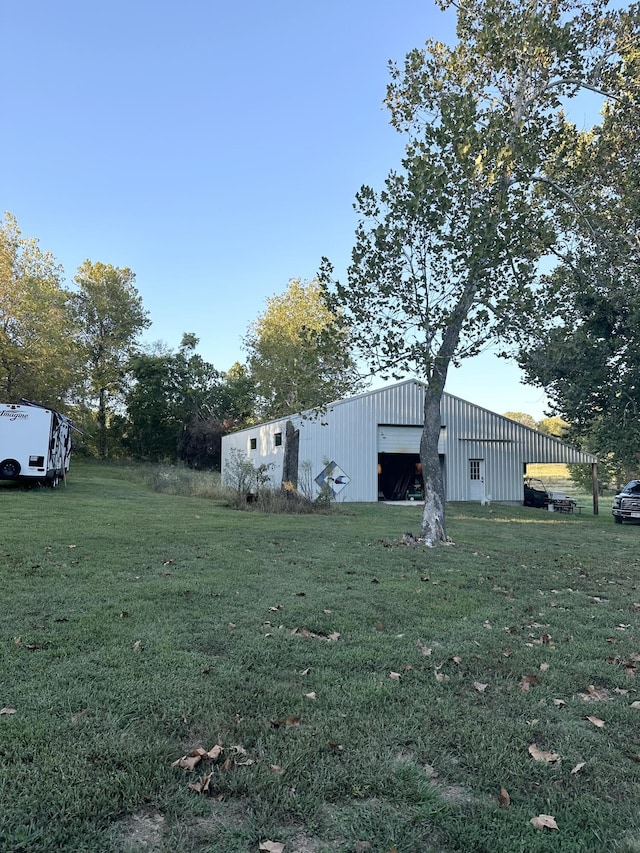 7020 N Farm Road 69, Walnut Grove, MO 65770 - view of yard featuring an outbuilding and a garage