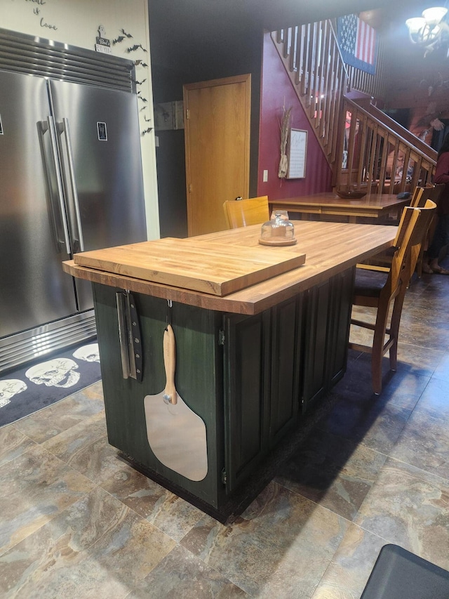 7020 N Farm Road 69, Walnut Grove, MO 65770 - bar featuring high end refrigerator, stone finish floor, and stairs