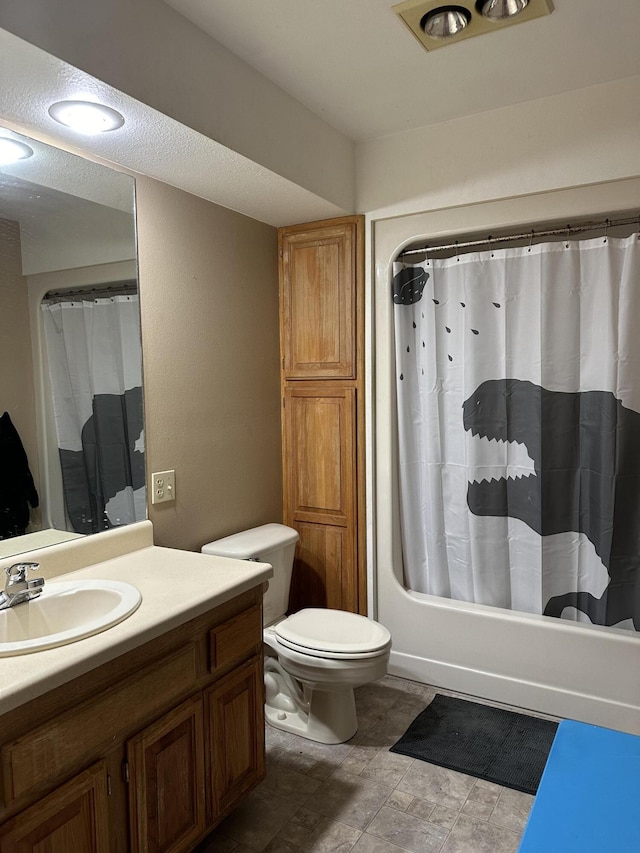 7020 N Farm Road 69, Walnut Grove, MO 65770 - full bathroom with shower / tub combo with curtain, vanity, stone finish flooring, and toilet