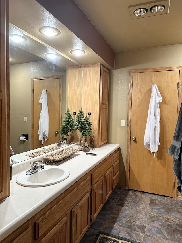 7020 N Farm Road 69, Walnut Grove, MO 65770 - bathroom featuring vanity and stone finish flooring
