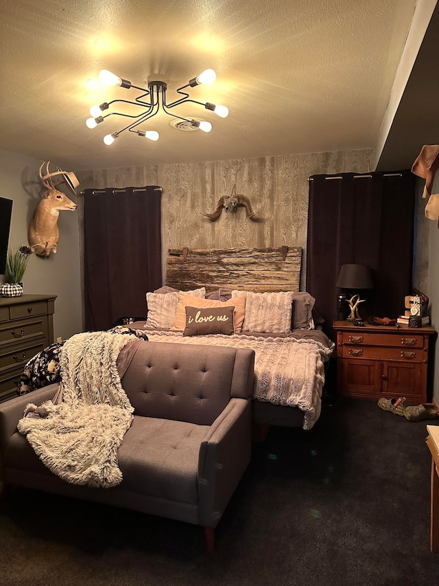 carpeted bedroom with a textured ceiling