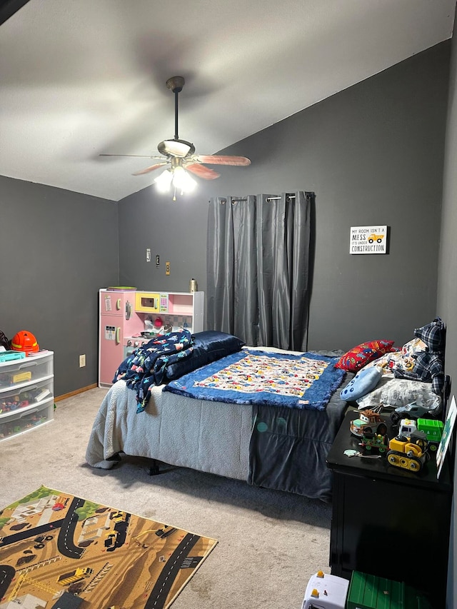 carpeted bedroom featuring vaulted ceiling and ceiling fan