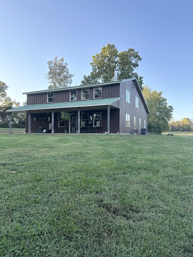7020 N Farm Road 69, Walnut Grove, MO 65770 - back of house with a lawn and board and batten siding