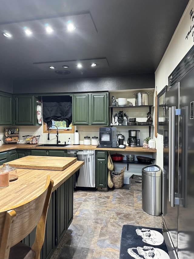 7020 N Farm Road 69, Walnut Grove, MO 65770 - kitchen with a sink, green cabinetry, butcher block countertops, open shelves, and appliances with stainless steel finishes