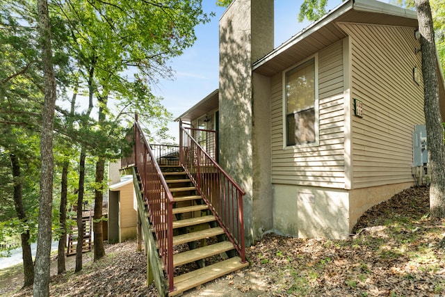 view of home's exterior with a wooden deck