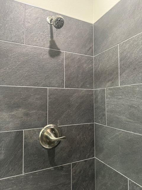 details with a tile shower