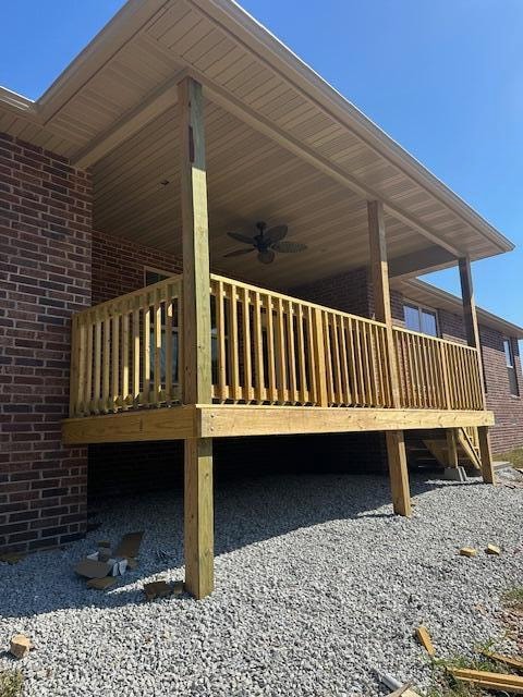 exterior space with a wooden deck and ceiling fan