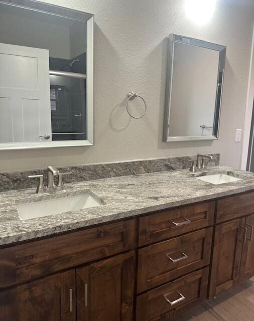 bathroom featuring vanity and hardwood / wood-style floors