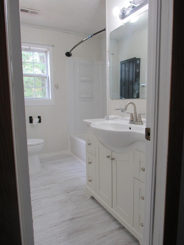 full bathroom with shower / bathing tub combination, vanity, hardwood / wood-style floors, and toilet