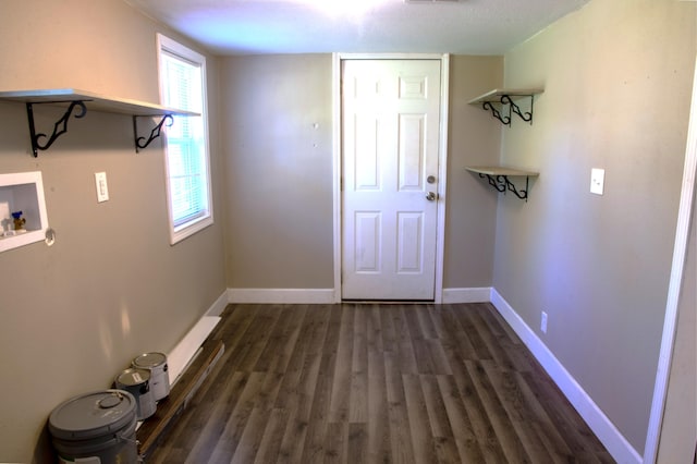 laundry room with dark wood-style floors, baseboards, hookup for a washing machine, and laundry area