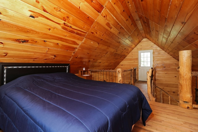 bedroom featuring wooden walls, lofted ceiling, hardwood / wood-style floors, and wood ceiling