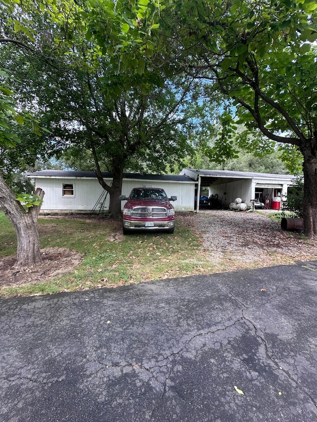 view of front of property with a carport