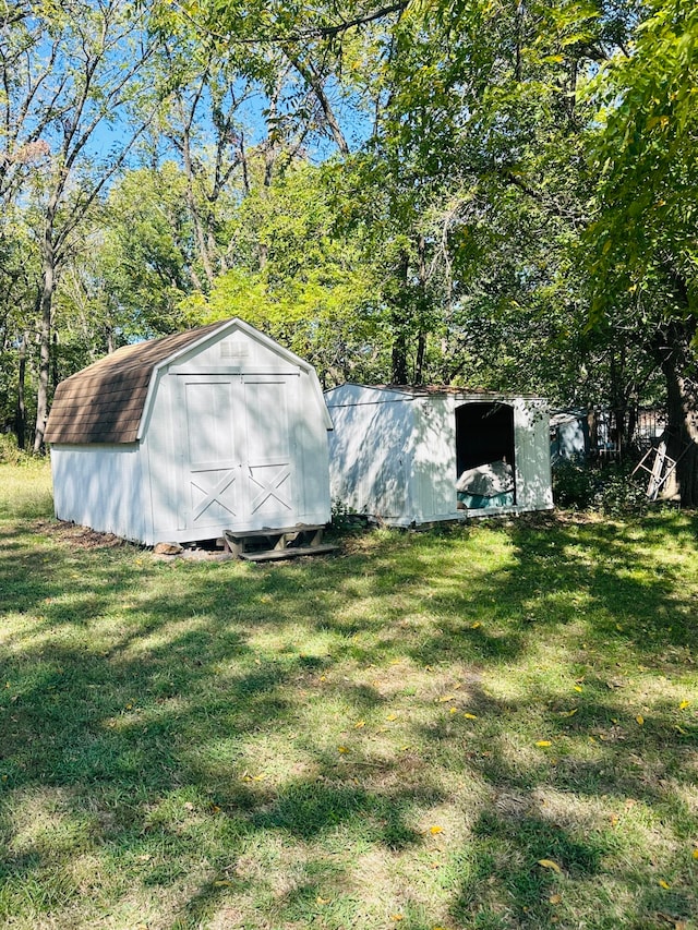 view of outbuilding featuring a lawn