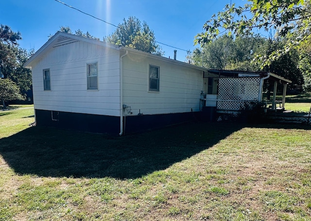 view of property exterior featuring a lawn