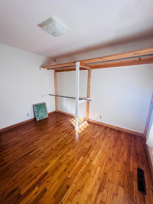 basement with light hardwood / wood-style floors