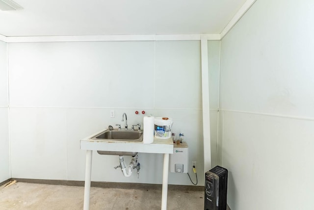 laundry area with visible vents and a sink