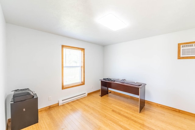 miscellaneous room featuring a baseboard radiator, hardwood / wood-style floors, and an AC wall unit