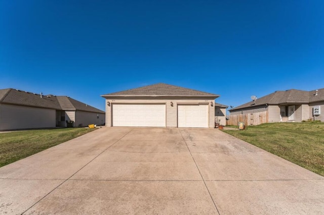 exterior space with a garage and a yard