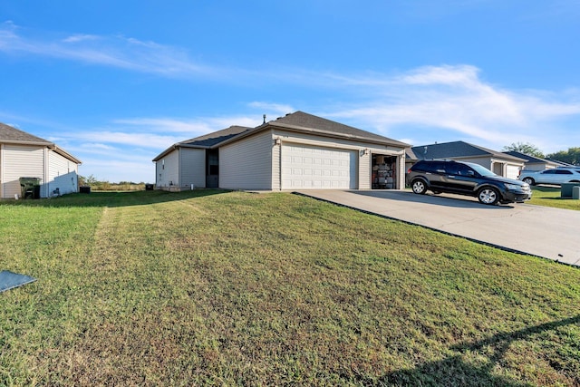 exterior space featuring a garage and a front lawn