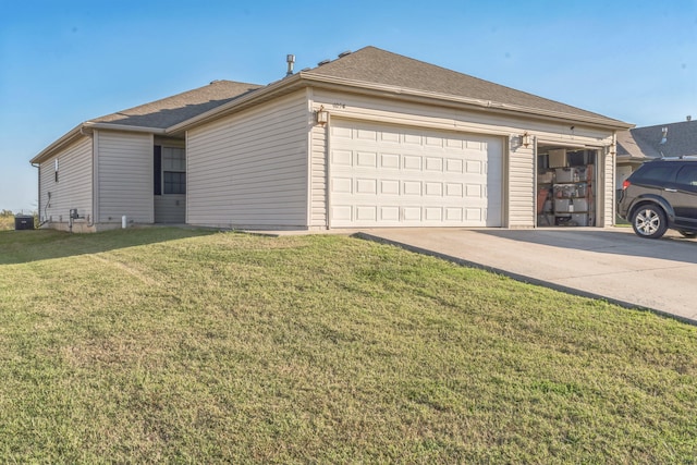 view of home's exterior with a garage and a lawn