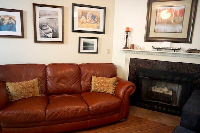 sitting room featuring a fireplace and hardwood / wood-style flooring