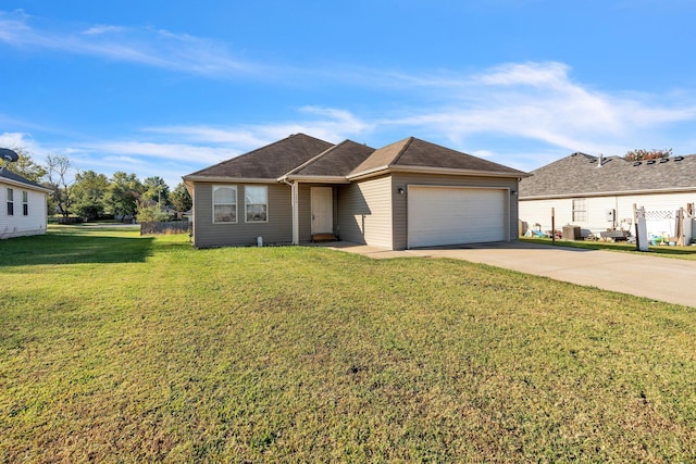 view of front of house featuring a front yard, cooling unit, and a garage