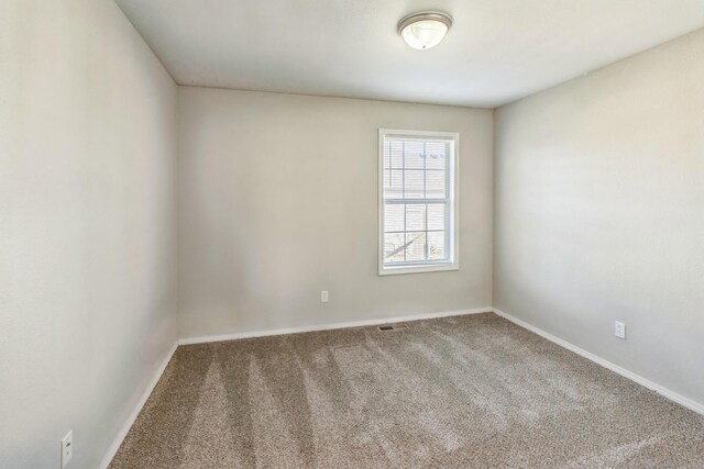 330 W Summit St, Aurora, MO 65605 - carpeted empty room with baseboards and visible vents