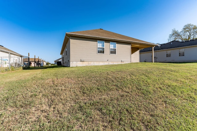 rear view of house with a lawn