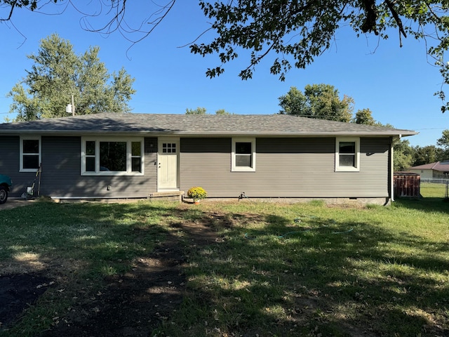 ranch-style home with a front yard