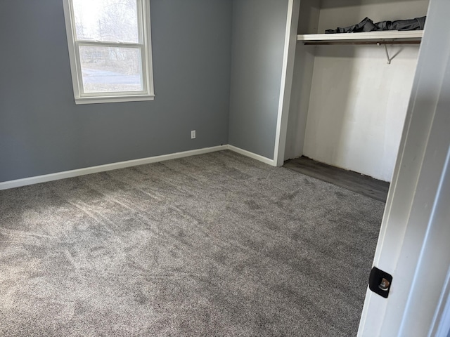 unfurnished bedroom featuring a closet and carpet flooring