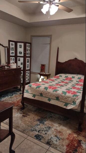 bedroom featuring ceiling fan and tile patterned flooring