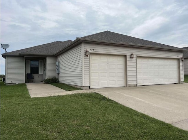 single story home with a garage and a front lawn