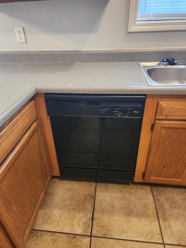 details with a sink, brown cabinets, and black dishwasher