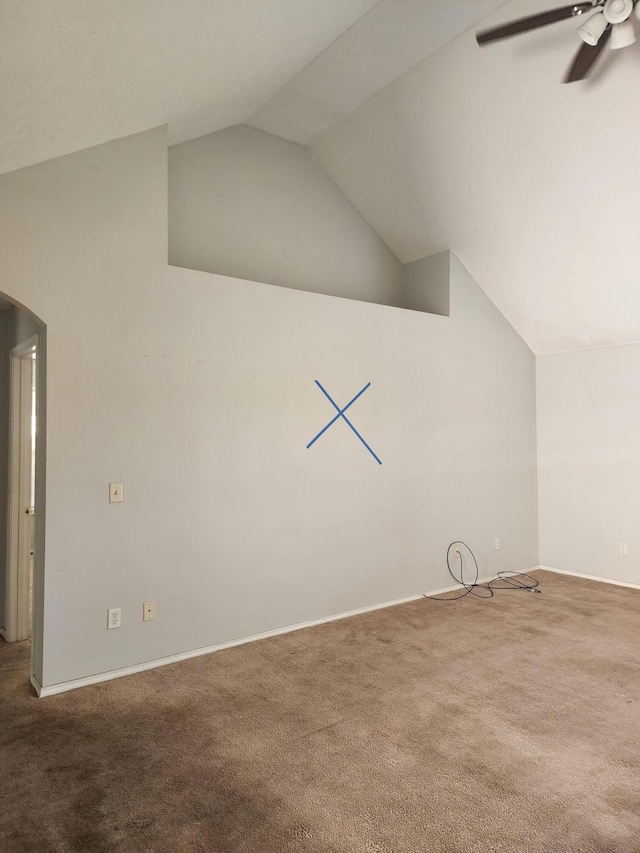 additional living space featuring carpet, vaulted ceiling, arched walkways, and a ceiling fan