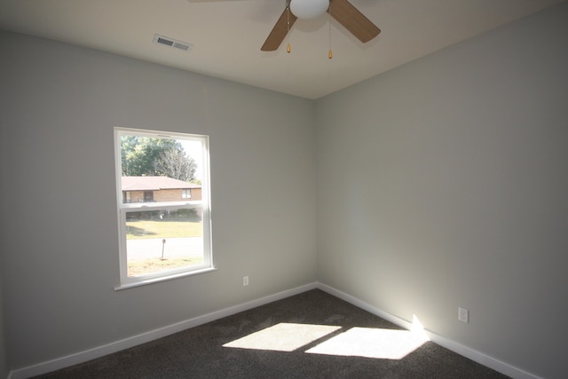 carpeted empty room with ceiling fan