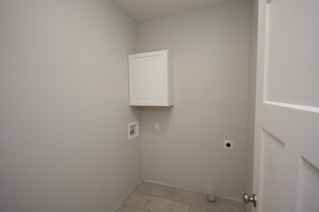 laundry area with washer hookup, cabinets, light tile patterned floors, and electric dryer hookup