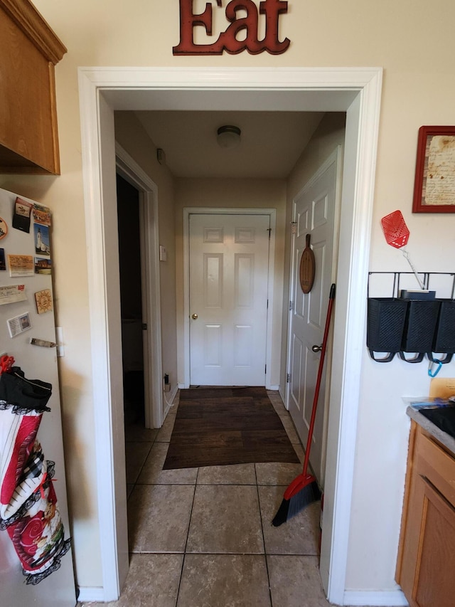 corridor with tile patterned floors