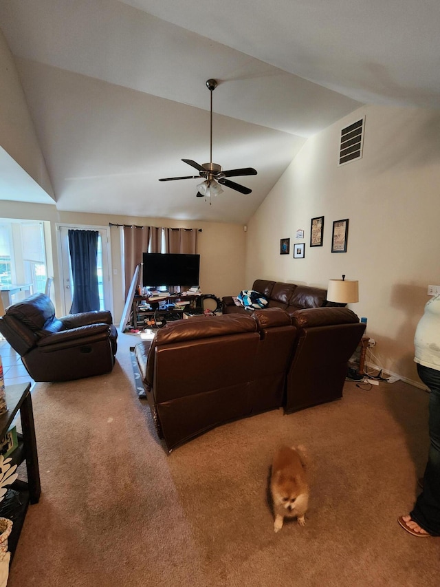 carpeted living room featuring ceiling fan and vaulted ceiling